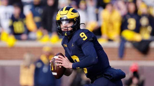 Michigan Wolverines quarterback J.J. McCarthy looks to pass against the Ohio State Buckeyes.